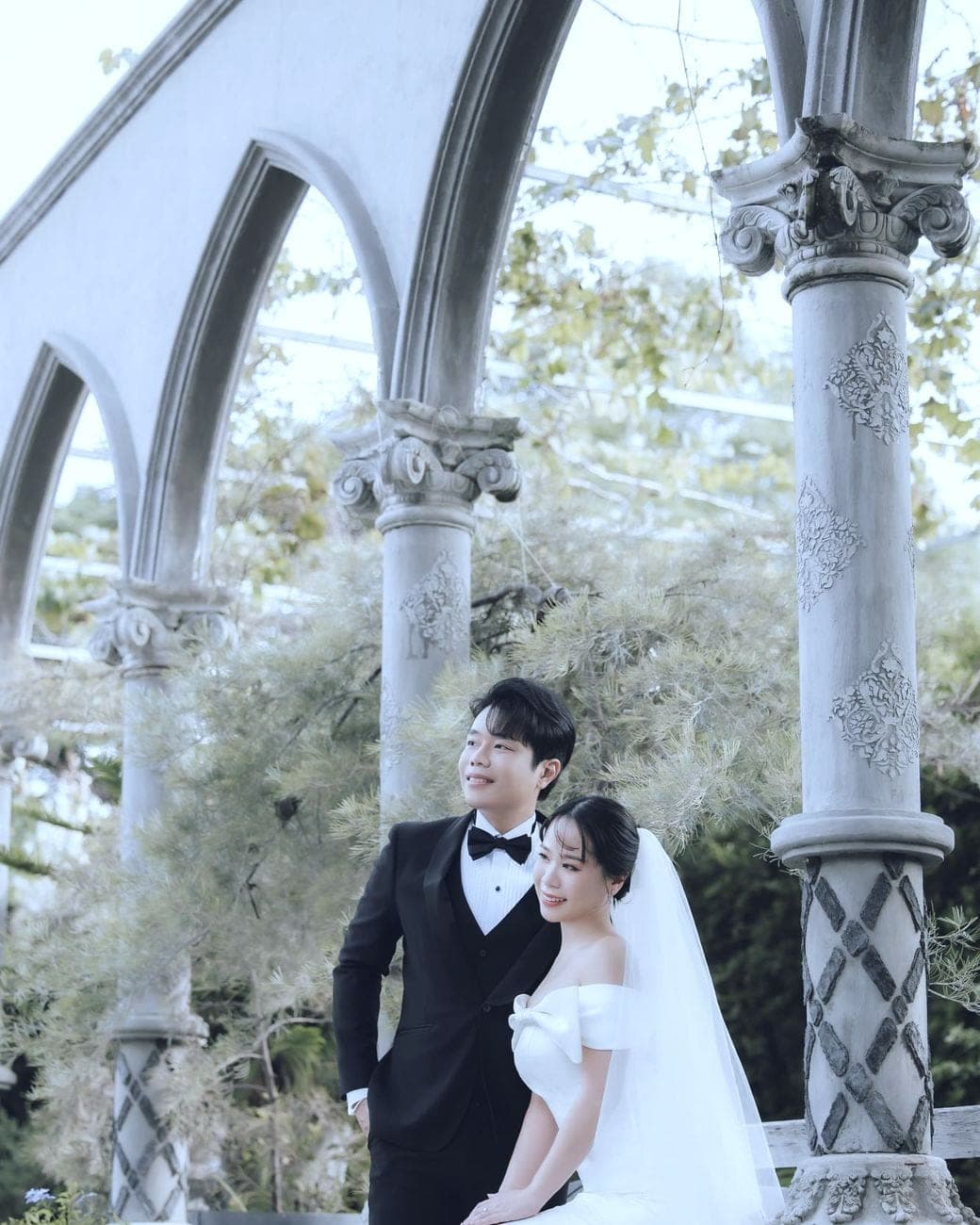 Witita and Sorratat under stone arches open to the sky